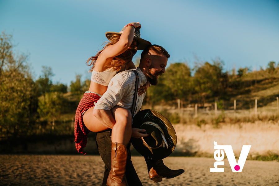 Sex Position Names Shop Online Reverse cowgirl sex position guide showing a couple exploring a playful rear-facing position outdoors