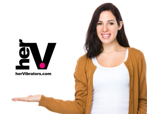 A brunette woman wearing a white shirt and brown cardigan, presenting the hervibrators. Com logo for an eroscillator guide.