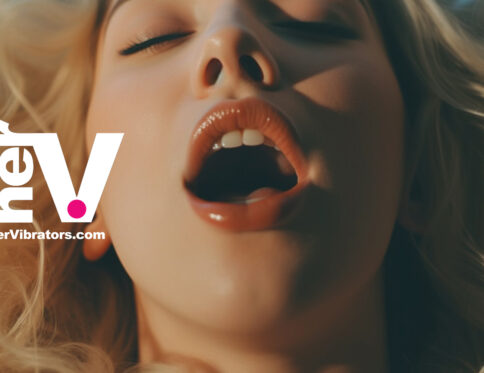 Close-up of a blonde woman with parted lips in a state of pleasure, featuring the hervibrators. Com logo, representing a beginner vibrator experience.