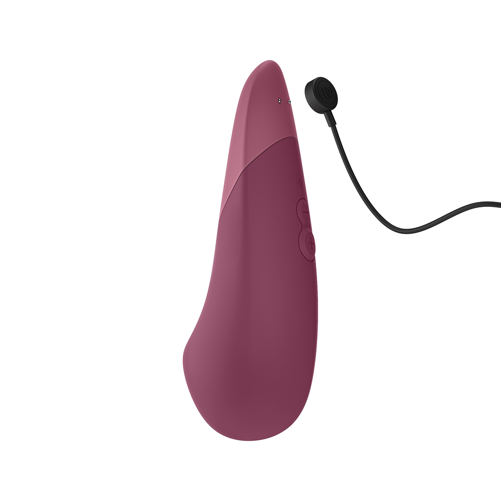 Charging setup for Pink Womanizer vibrator including cable
