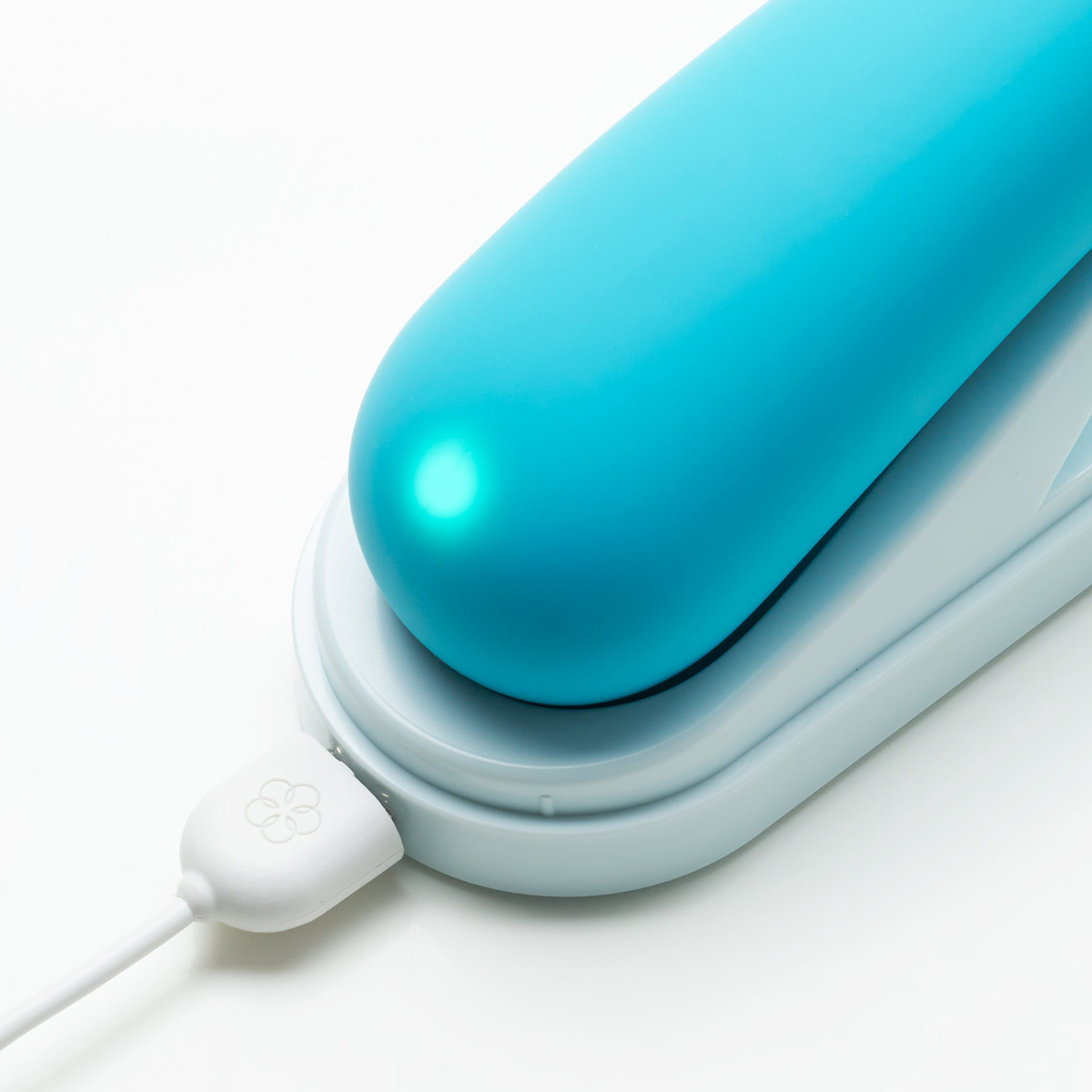 Angled view of the  TENGA vibrator designed for intimate use