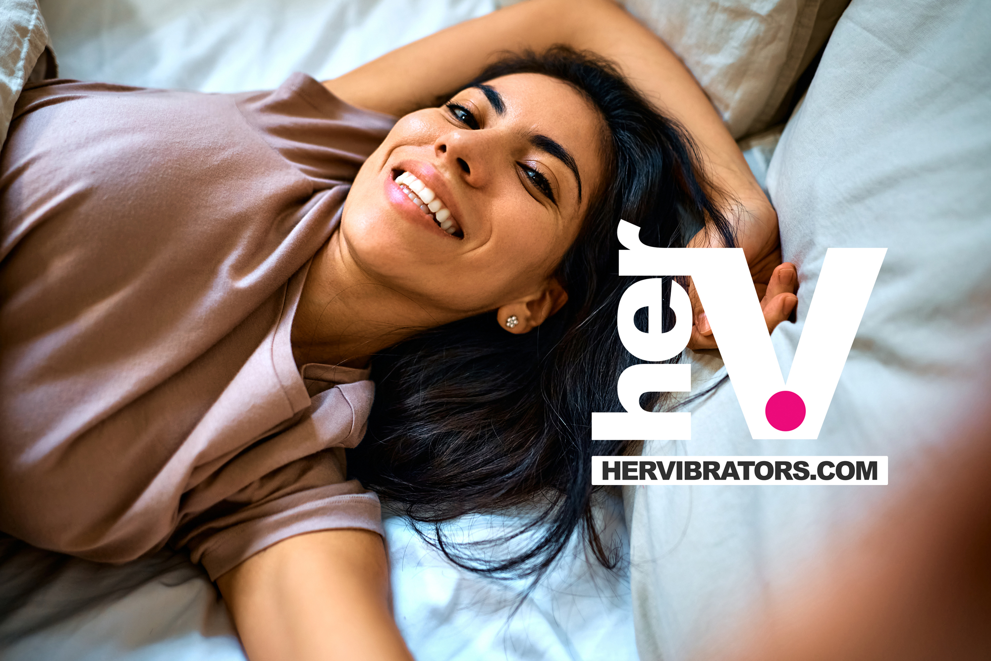 Smiling woman relaxing in bed after choosing the best sex lube for smooth, comfortable intimacy