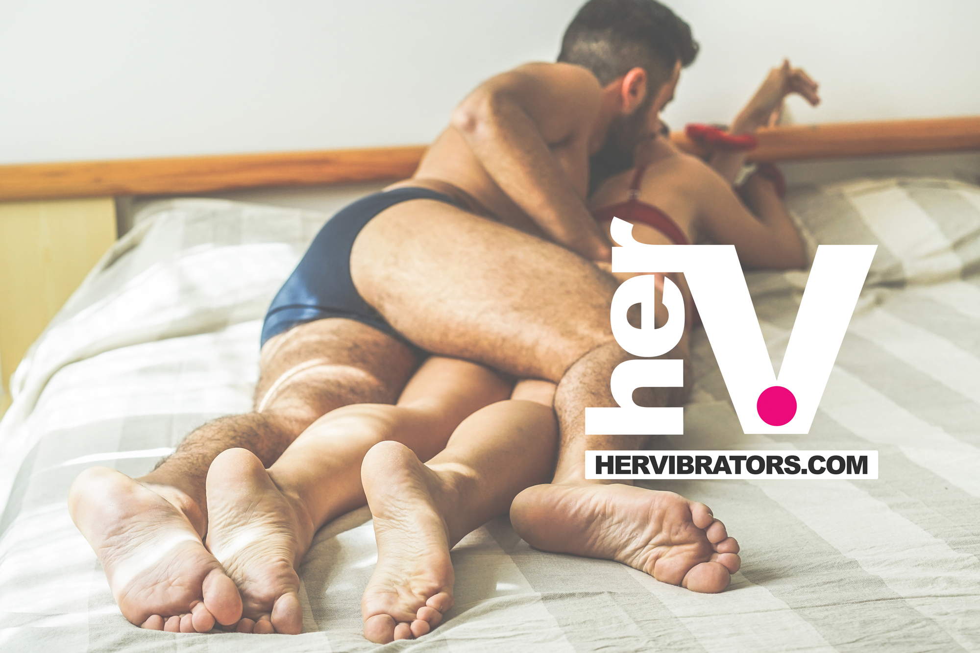 bottle of silicone based anal lube shown with a smooth reflective surface to suggest silky long lasting anal glide