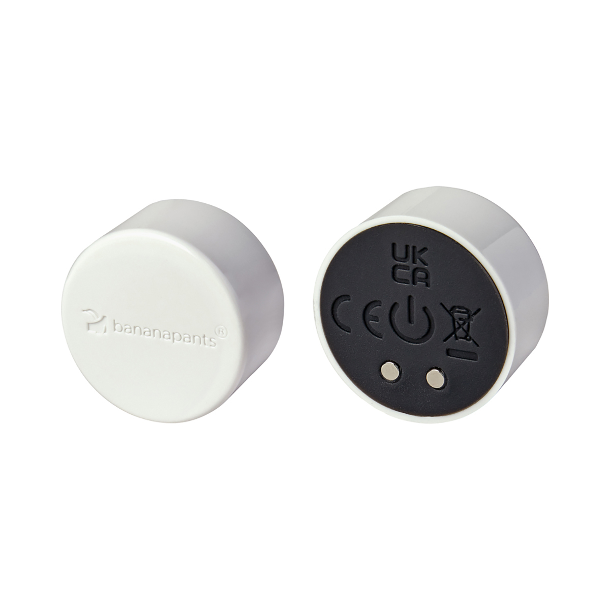 White Black Banana Pants vibrator Puck shown in hand for scale