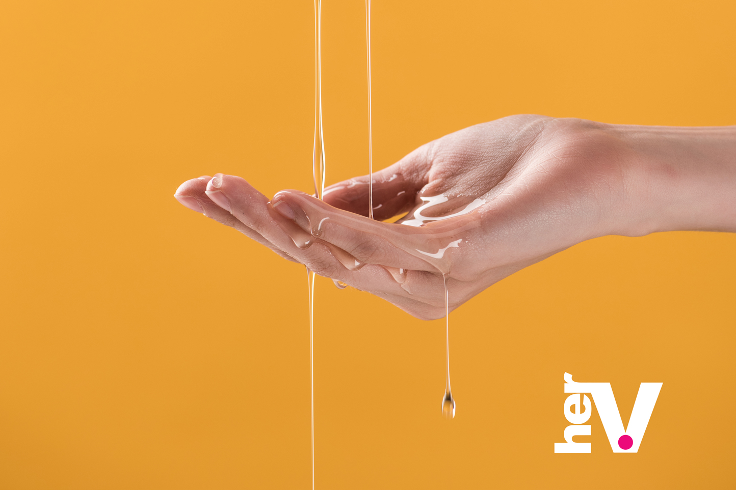 Sex lube applied to fingertips demonstrating smooth, body-safe lubrication for intimate comfort and pleasure