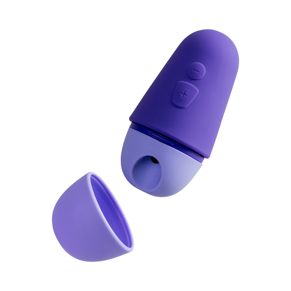 ROMP vibrator Free X shown in hand for scale