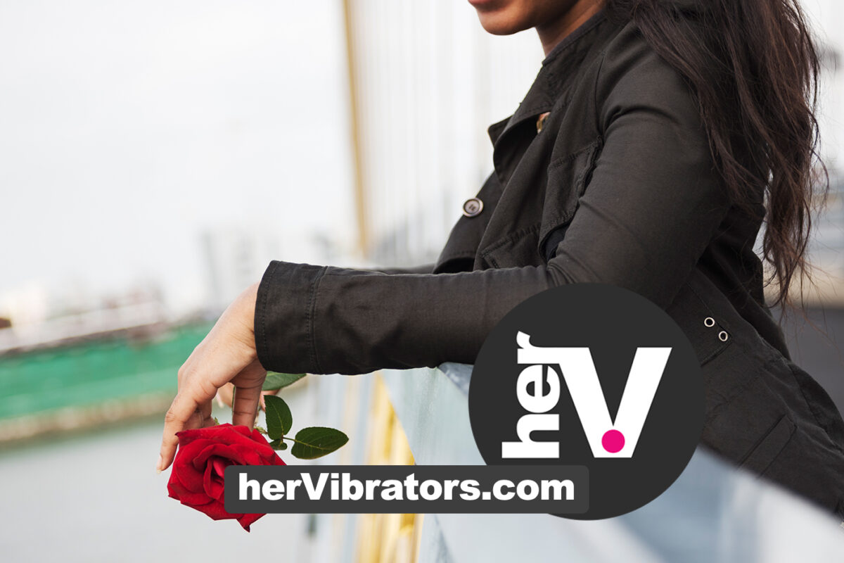 Woman holding a red rose for the hervibrators guide explaining how to use a rose vibrator